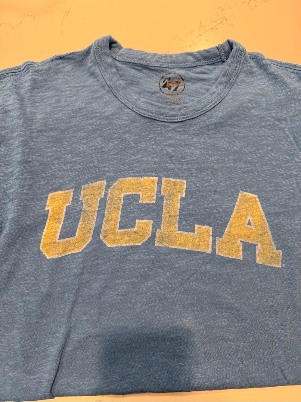 UCLA Vintage-Style Light Blue Graphic Tee. ‘47 brand